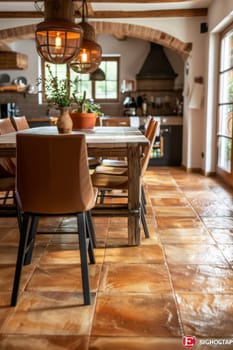 A large room with a dining table and chairs, and a rug on the floor. The room has a rustic feel with a lot of wood and brick elements
