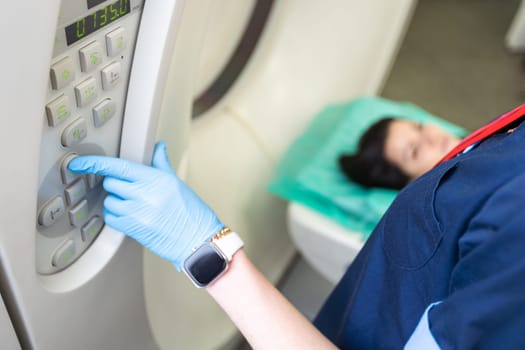 beautiful woman lying on ct scanner bed during tomography test in hospital.