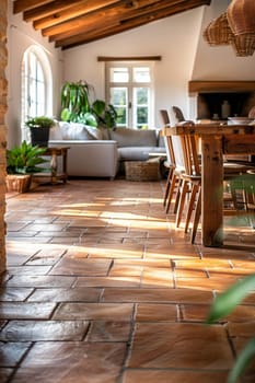 A large room with a dining table and chairs, and a rug on the floor. The room has a rustic feel with a lot of wood and brick elements