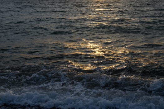 Bright sunset over the Mediterranean Sea Cyprus golden clouds reflected in the water 3