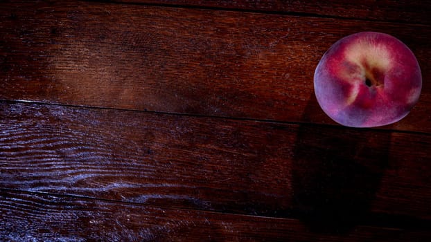 Fresh juicy peaches on rustic wooden table