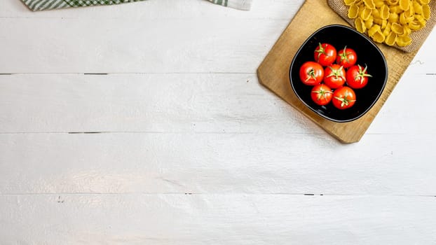 Beautiful tasty Italian pasta, tomatoes, onions and garlic for cooking pasta