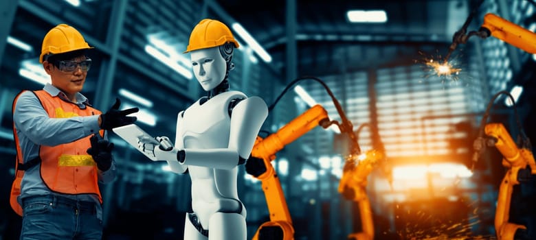 MLP Mechanized industry robot and human worker working together in future factory. Concept of artificial intelligence for industrial revolution and automation manufacturing process.