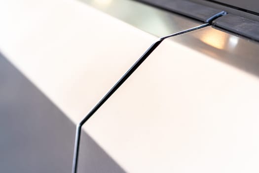 Denver, Colorado, USA-May 5, 2024-A close-up image capturing the precise panel seam of the Tesla Cybertruck, highlighting the minimalist design and sharp contours that characterize the exterior of this innovative electric vehicle.