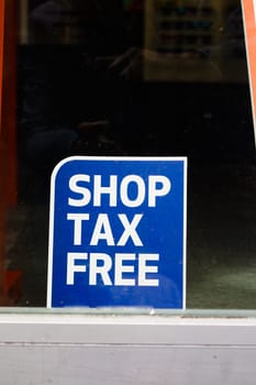 shop tax free text duty free shop sign on shop window ,