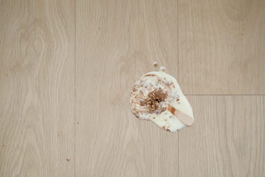 ice cream melting and spilling on floor