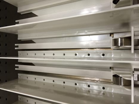 Parts of a Plastic Shelf Pusher System for Retail Merchandising. Store fixtures. High quality photo