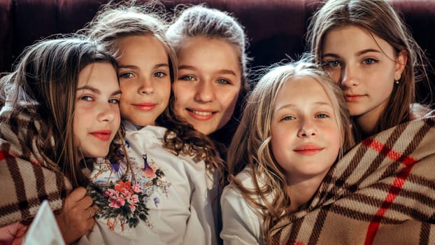 Cargo portrait of the children of girls wrapped in a blanket. Yaremche, Bukovel, Ukraine - January 10, 2022