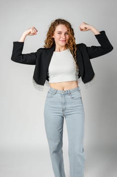 Young Woman Posing With Arms Raised in Studio close up