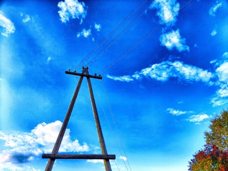 Old pole with wires against the sky. Electric transmission line, Eco-friendly energy