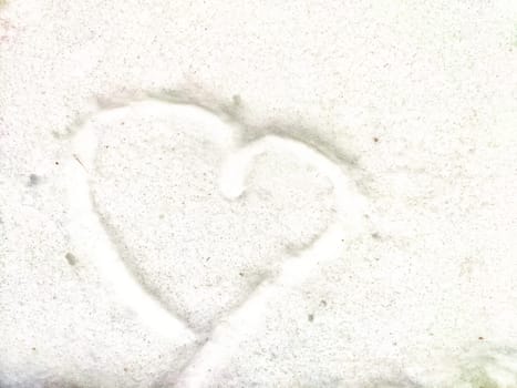 Heart on snow. Hearts traced on white blanket of snow. Background, texture. Valentine's day