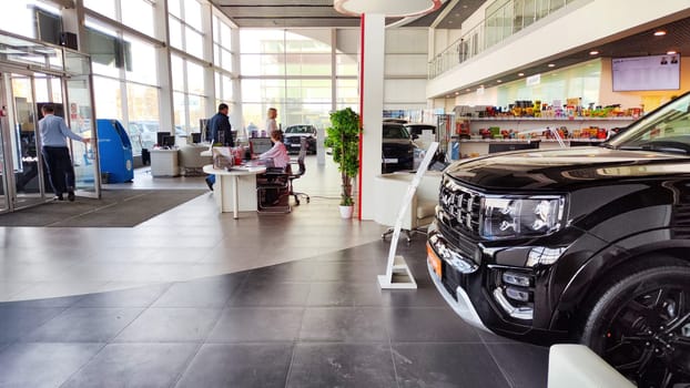 Cheboksary, Russia - April 05, 2023: Cars in showroom of dealership KIA. Re-export to Russia