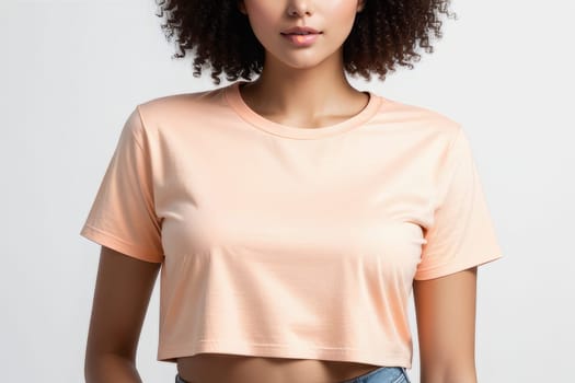 Woman in peach fuzz colored tshirt, can be used for design, mock up. The trending color of 2024