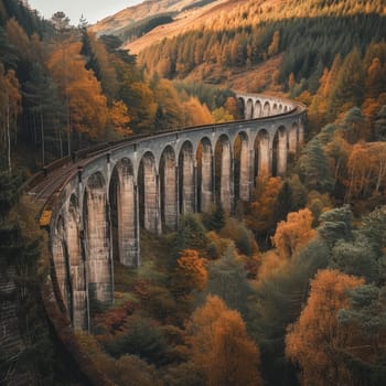 Majestic viaduct bridge cutting through a forest in full autumn splendor