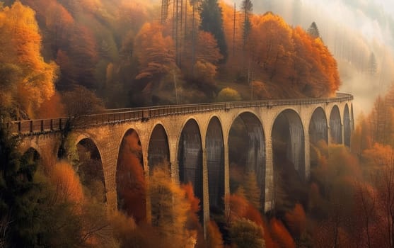 Old viaduct bridge enveloped in fog with autumn colors in the surrounding forest