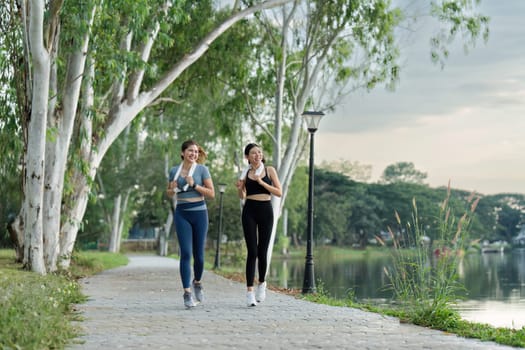 Running woman. Female Runner Jogging during Outdoor Workout in a Park. Healthy lifestyle. Morning.