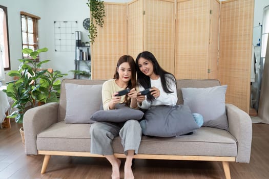 gay couple hug on sofa to relax together in healthy relationship love connection. Lgbtq couple concept.