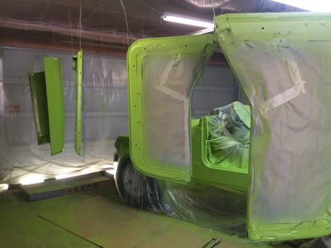 Auto Body Restoration in my Garage, Lime Green Paint Job, 1990s Vehicle . High quality photo