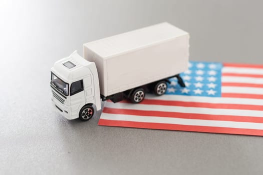 USA Logistics Concept. White Delivery Van on USA Flag background. 3d Rendering. High quality photo