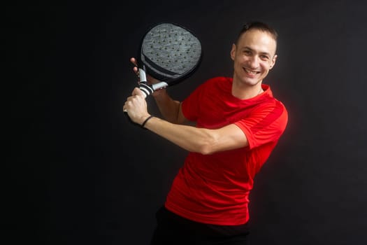 Young man playing the paddle. High quality photo