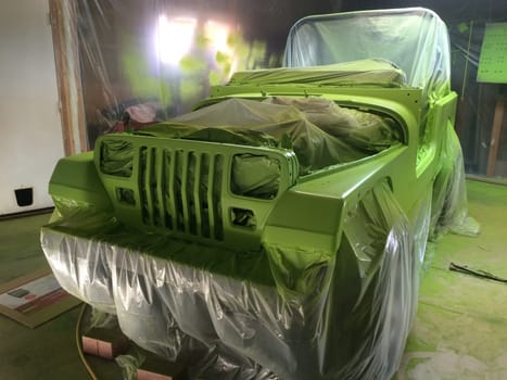 Front View, Auto Body Restoration, Lime Green Paint Job, 1990s Vehicle . High quality photo