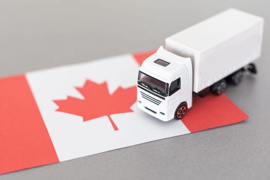 Symbol of National Delivery Truck with Flag of Canada. National Trucking Icon and Canadian flag. High quality photo