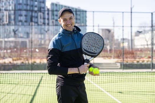 paddle tennis coach teaching on a residential paddle court, front view. High quality photo