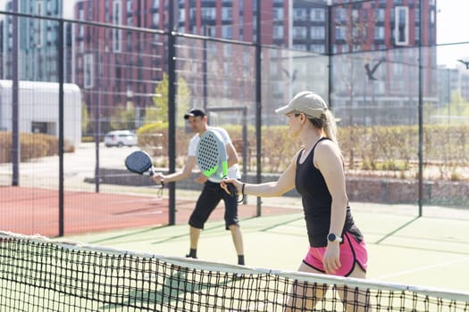 Padel lesson with a coach, personalized instruction in a supportive environment. High quality photo