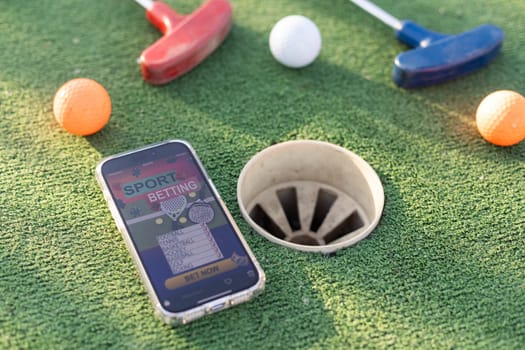 mini golf sports betting on a smartphone. High quality photo