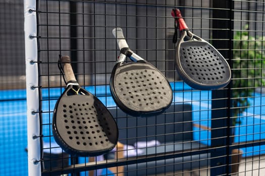 Paddle objects on blue court. High quality photo