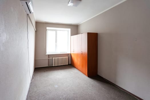 Empty room with all white walls and parquet floor. Nobody inside the room. High quality photo