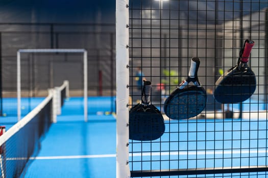 rackets and paddle balls on a court ready to play. High quality photo