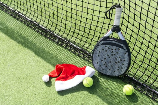 Christmas Open Padel Tournament. Poster for social networks for New Year's games. Padel tennis racket on tournament. paddle racket on court . High quality photo