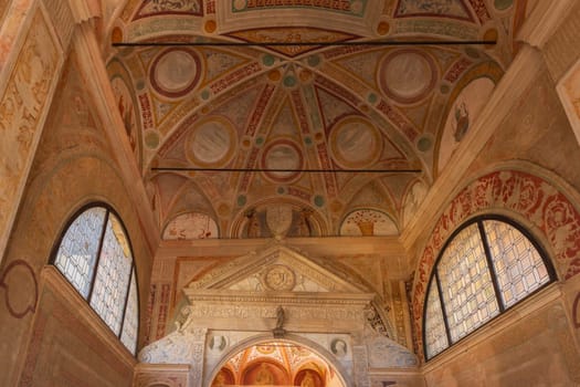 The ceiling of a Certosa di Pavia Monastery is decorated with a variety of designs and patterns. Scene is one of reverence and awe, Pavia, Italy.