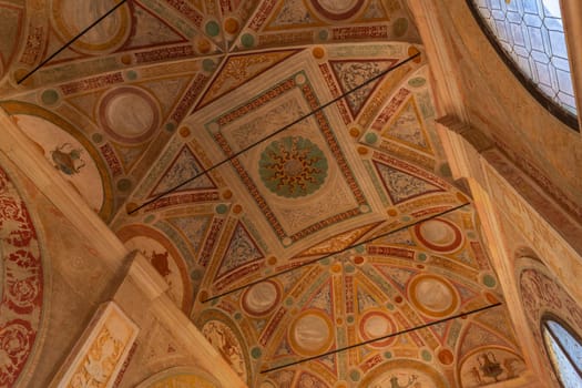 The ceiling of a Certosa di Pavia Monastery is decorated with a variety of designs and patterns. Scene is one of reverence and awe, Pavia, Italy.