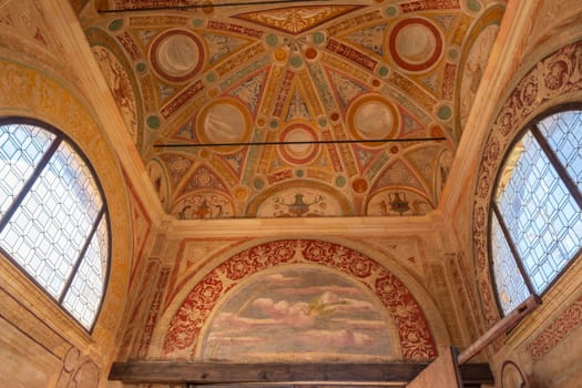 The ceiling of a Certosa di Pavia Monastery is decorated with a variety of designs and patterns. Scene is one of reverence and awe, Pavia, Italy.