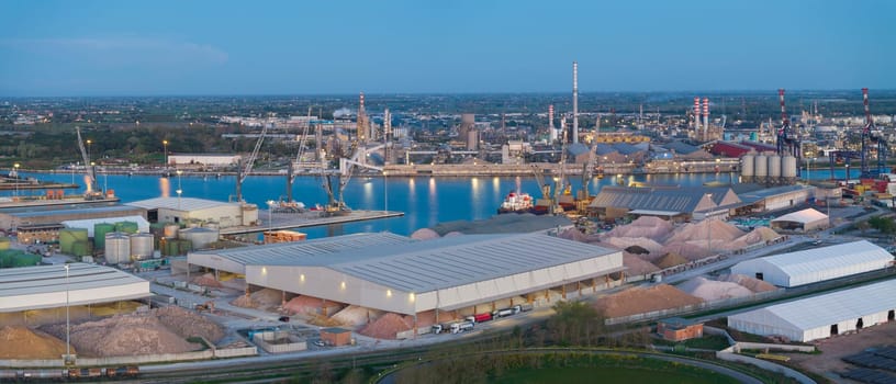 Aerial view of the industrial and port area of Ravenna ,chemical and petrochemical pole,thermoelectric,metallurgical plants and hydrocarbon refinery and liquefied natural gas tanks