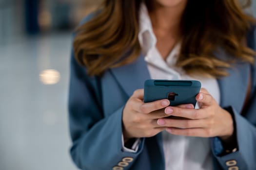 Close-up of woman's hands using modern smartphone device for texting and messaging, social media and communication concept, lifestyle woman working