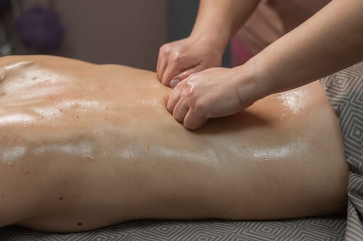 Woman having a therapeutic back massage