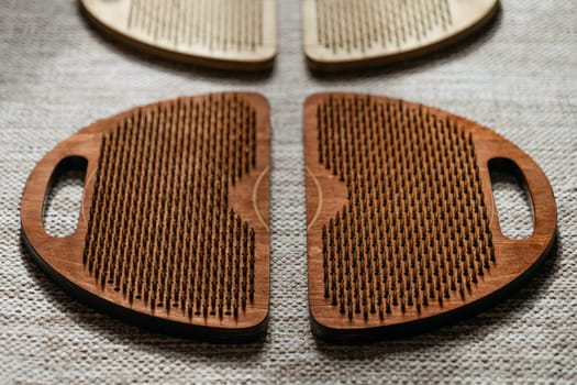 The interplay of light and shadow on sadhu boards, accentuating their textured surface.