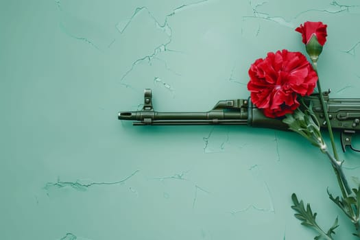 A military rifle adorned with red carnations symbolizes the Carnation Revolution during Portugal Day celebrations.
