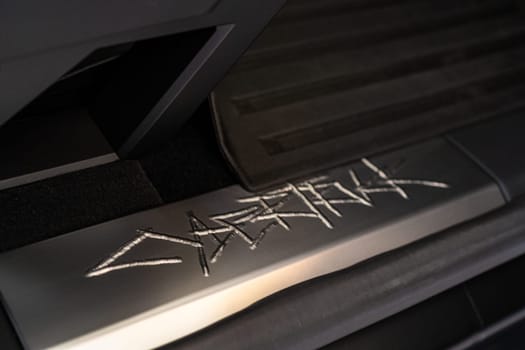 Denver, Colorado, USA-May 5, 2024-This image showcases the distinctive metal engraving of the Cybertruck logo on the interior of a Tesla Cybertruck, highlighting the vehicle unique branding elements and detailed craftsmanship.