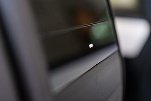 Denver, Colorado, USA-May 5, 2024-This image provides a close-up look at a car door opener, showcasing the clean lines and modern design typical of contemporary vehicle interiors. The focus on the mechanism highlights its sleek, minimalist style.