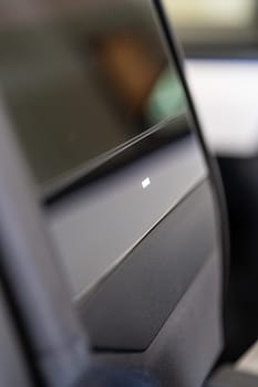 Denver, Colorado, USA-May 5, 2024-This image provides a close-up look at a car door opener, showcasing the clean lines and modern design typical of contemporary vehicle interiors. The focus on the mechanism highlights its sleek, minimalist style.