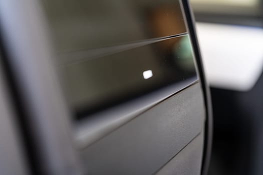 Denver, Colorado, USA-May 5, 2024-This image provides a close-up look at a car door opener, showcasing the clean lines and modern design typical of contemporary vehicle interiors. The focus on the mechanism highlights its sleek, minimalist style.