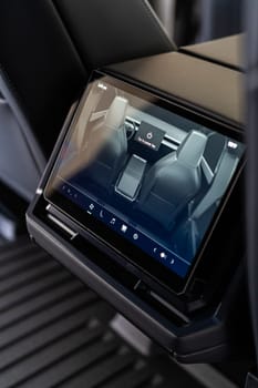 Denver, Colorado, USA-May 5, 2024-This image captures the sophisticated rear seat screen interface in the Tesla Cybertruck, highlighting the vehicle cutting-edge technology and user-friendly features, offering passengers control and comfort during their journey.