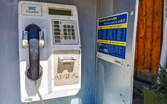 Old telephone box with handset and keypad in Zicatela Puerto Escondido Oaxaca Mexico.