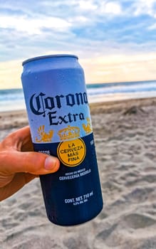 Modelo beer can on the beach at sunset in Zicatela Puerto Escondido Oaxaca Mexico.