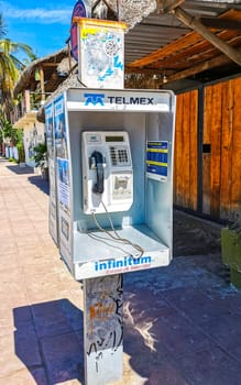 Old telephone box with handset and keypad in Zicatela Puerto Escondido Oaxaca Mexico.