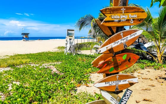 Advertising sign on surfboard surf board in Zicatela Puerto Escondido Oaxaca Mexico.